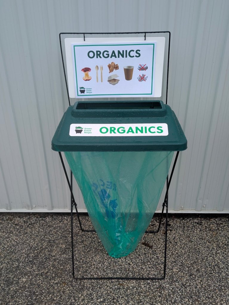 Single X-frame event organics bin with green lid, compostable liner and sign